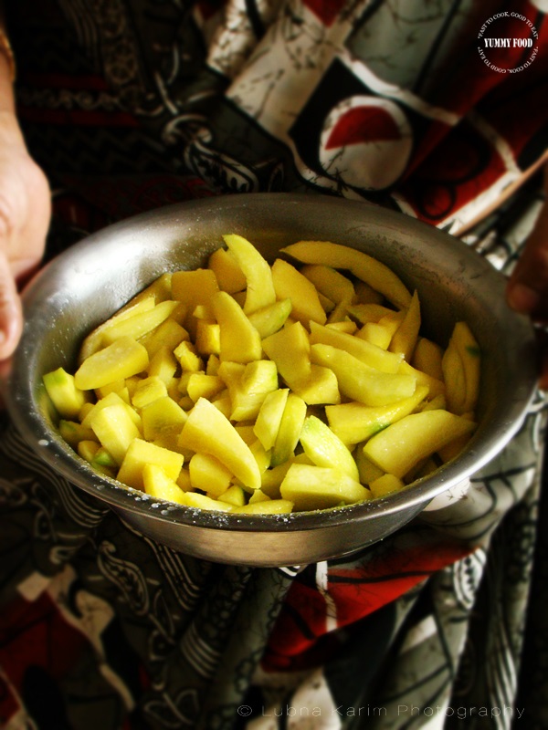 Soak the firm raw green mangoes in enough water overnight.